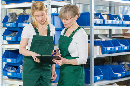 View of female storage workers in warehouseの写真素材