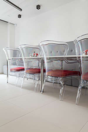 Modern and interesting plastic chairs on corridorの写真素材