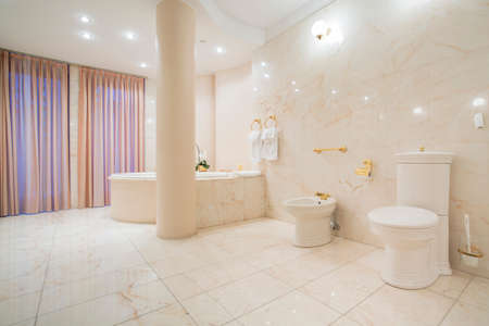 Spacious greek style bathroom with marble floorの写真素材
