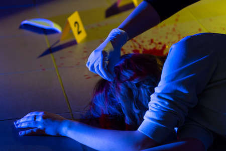Victim of crime and forensic science technicianの写真素材