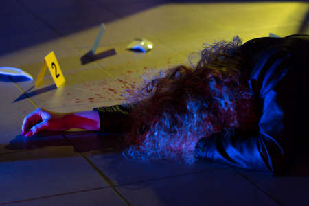 Image of dead woman lying on the floorの写真素材