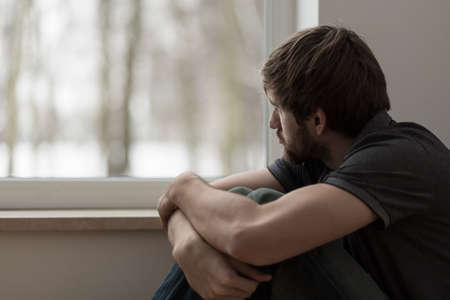 Portrait of young man suffering for depressionの写真素材