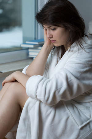 Young woman feeling bad in the morningの写真素材