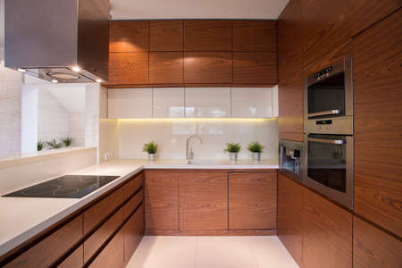 Wooden kitchen cabinet in luxury elegant interiorの写真素材