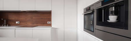 White kitchen housing unit in luxury interiorの写真素材