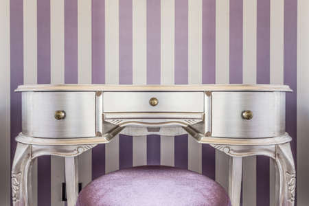 Silver baroque style commode in fancy roomの写真素材