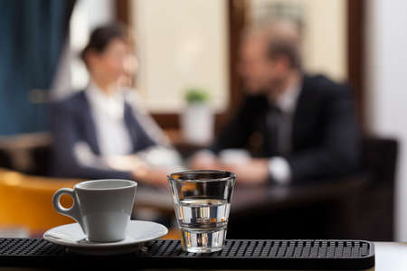 Close-up of tiny cup of espresso in hotel cafeの写真素材