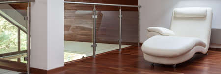 Mezzanine with wooden floor and white wallsの写真素材