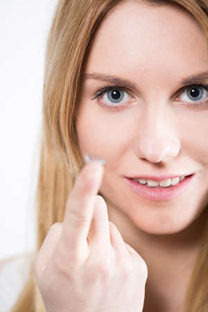 Portrait of young beautiful woman with contact lensの写真素材