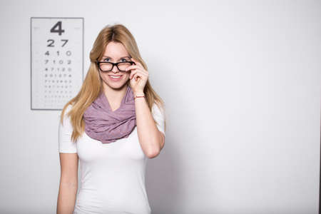 Young beautiful woman with glasses at optician's officeの写真素材