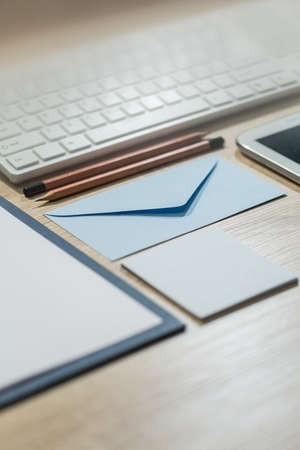 Close-up of blue small envelope prepared for addressの写真素材