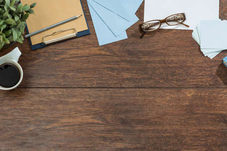 Cleaned space on wooden table prepared for workの写真素材