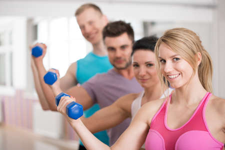 Portrait of group of smiling fitness instructors
