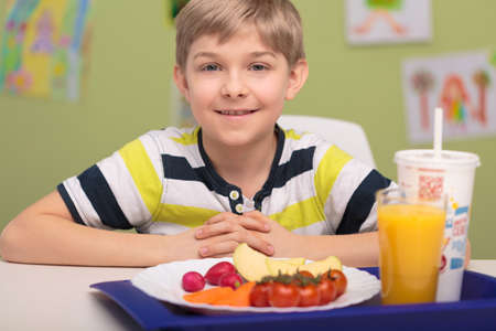 Portrait of smiling boy with school lunchの写真素材