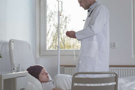 Doctor taking care of ill cancer patient