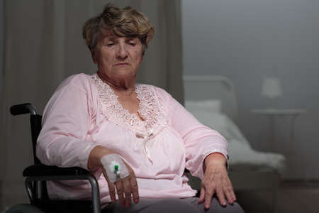 Portrait of ill disabled woman using wheelchair