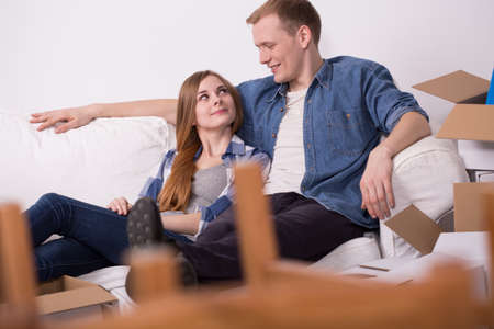 Happy couple of students renting a flat