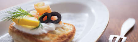 Close-up of fresh blintz with cream and tasty toppingの写真素材