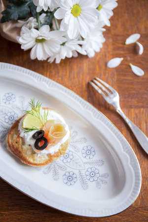 Delicious blintz with cream and salmon for healthy breakfastの写真素材