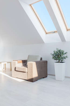 Big comfortable chair in white sunny roomの写真素材