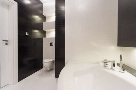 Exclusive black and white bathroom with big bathtubの写真素材