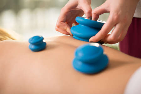 Close-up of chinese bubbles on young woman's backの写真素材