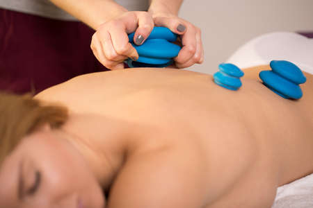 Young woman having a treatment by chinese bubblesの写真素材