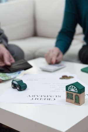 Old couple discussing problems with paying bills and creditsの写真素材