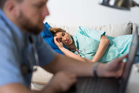Overworked nurse is resting in the medicine room