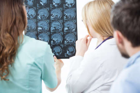 Doctors in doctor's room discussing an MRI