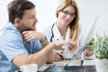 Younger doctor asks his older colleague for advice