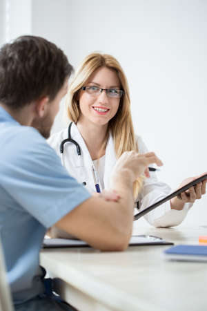 Young and happy medical professionals during medical consultation