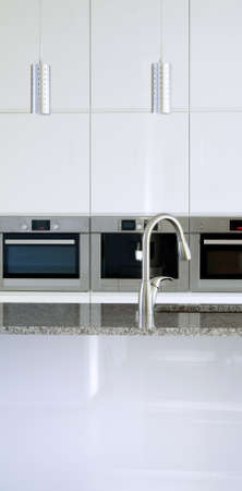 Minimalist modern kitchen with built-in appliancesの写真素材