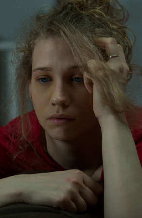 Young woman is missing her boyfriendの写真素材