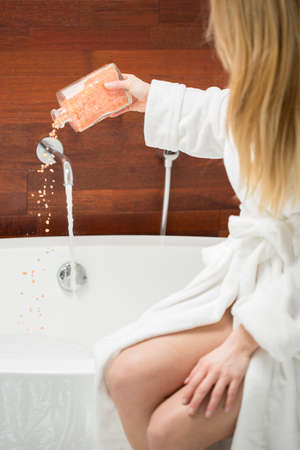 Woman is preparing to take a bath