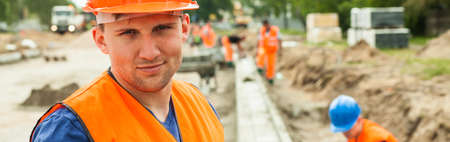 Construction worker is content because of his job