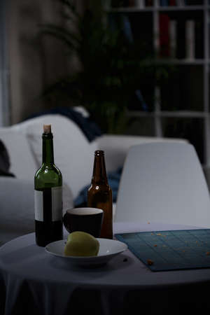 Bottle of wine and beer on the tableの写真素材