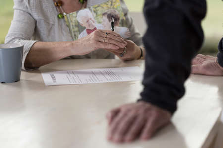 Man waiting for her putting up a signatureの写真素材