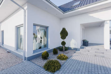 Outside of the newly built modern white houseの写真素材