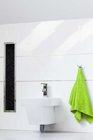 White bathroom with glossy details on the wallsの写真素材