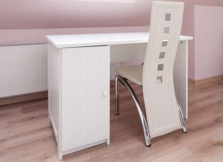 White desk and designed chair in study roomの写真素材