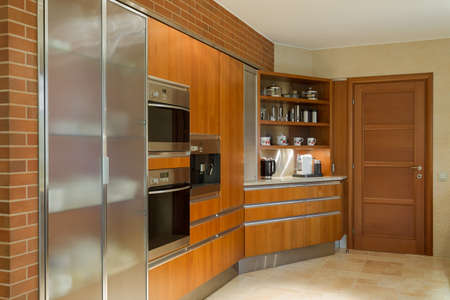 Wooden kitchen unit in beauty luxury kitchen