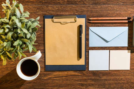 Well prepared notes and cup of black coffee on desk officeの写真素材