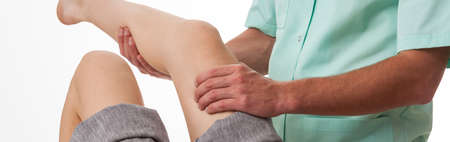 Panorama of physiotherapist doing exercise with patient