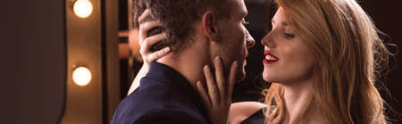 Pretty woman want to kiss a smart manの写真素材