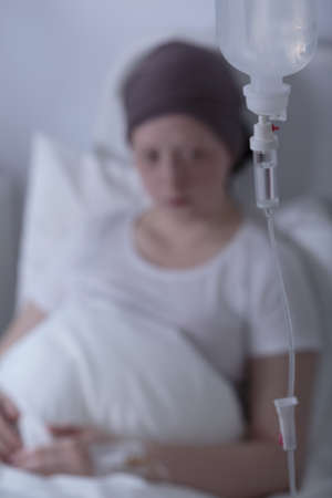 Close-up of patient's drip who is young girl with cancerの写真素材