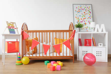 Picture of bright newborn room interior with colorful toysの写真素材