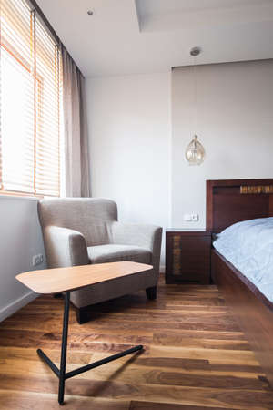Wooden floor in modern bedroom in apartment