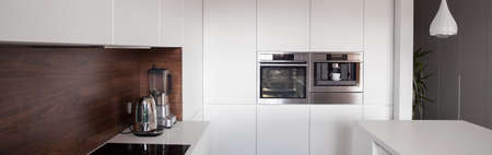 Luxury white kitchen in exclusive apartment, panoramaの写真素材