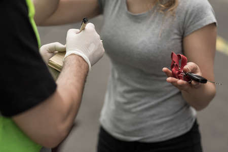 Woman guilty of car accident and policemanの写真素材